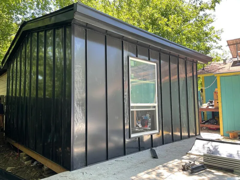 Black standing seam metal wall panels for Metal Roof Installation in Dunlap